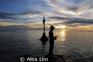 Sunset fishermen at Layang Layang by Alex Lim 